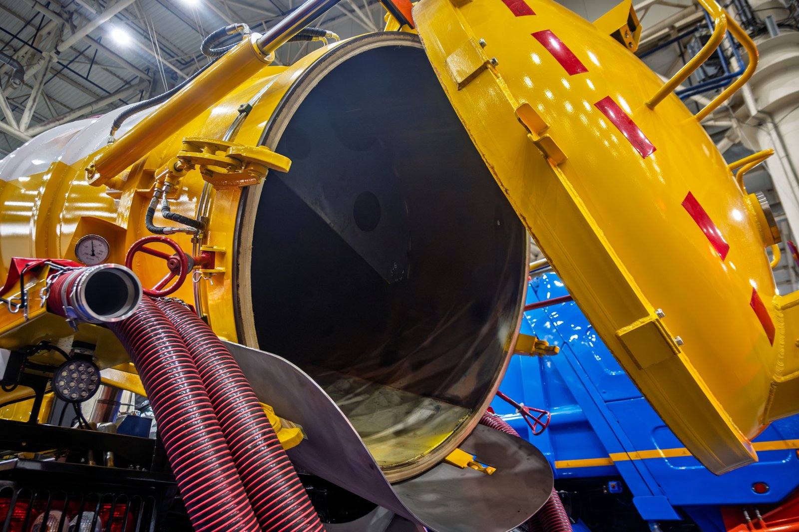 Vac truck with rear door open during inspection at Ames Hydraulics