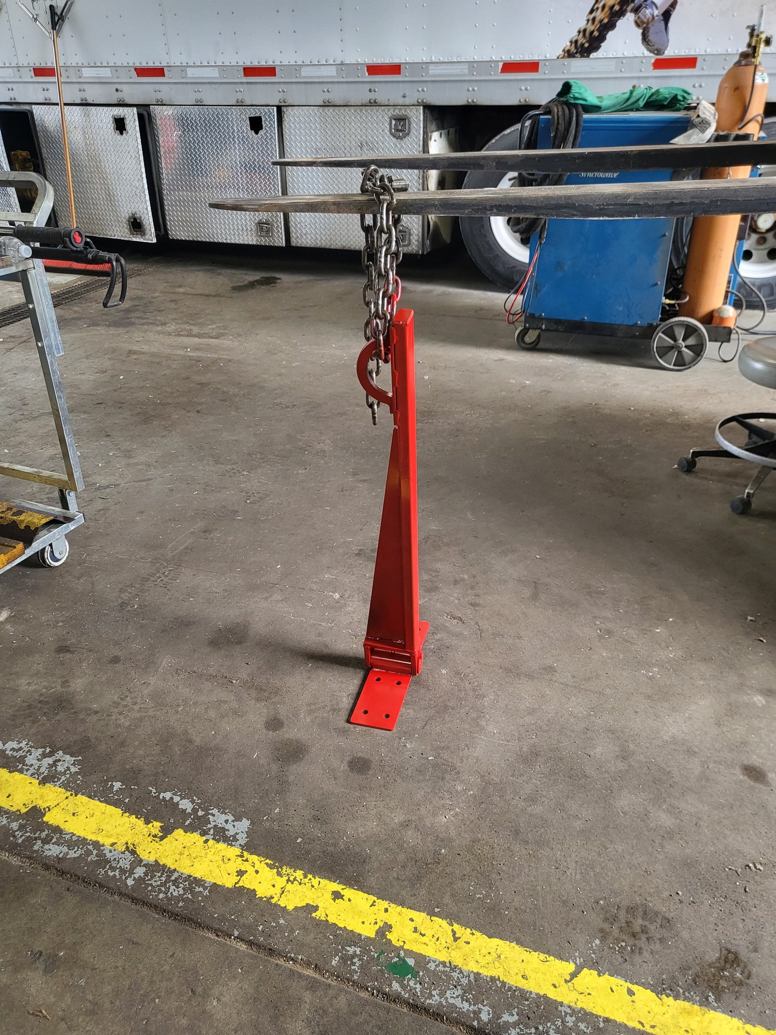 Custom-fabricated steel arm built at Ames Hydraulics in Ames, Iowa